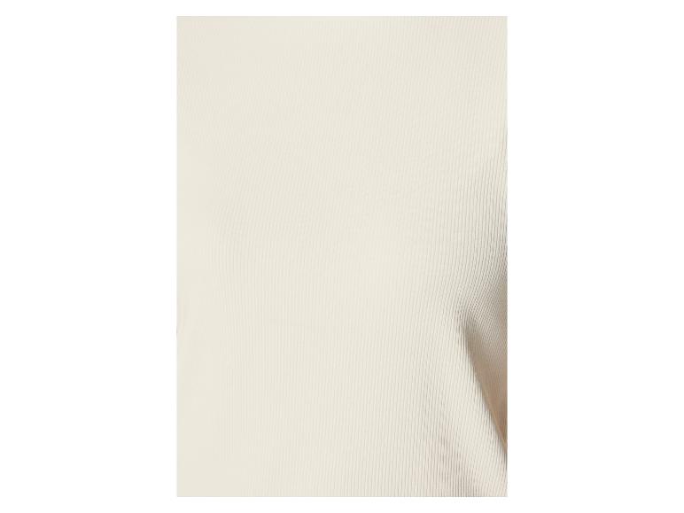Gros plan d'un tissu crème côtelé.