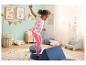 Peuter in roze Lupilu-legging die in een kinderkamer speelt.