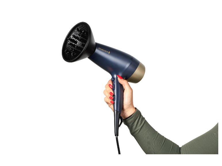Séchoir Remington : un sèche-cheveux bleu foncé avec embout concentrateur.