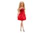 Blonde Barbiepop met rode jurk en zilveren hoge hakken.