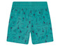 Short de bain turquoise avec des palmiers, des vagues et des planches de surf