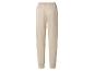 Pantalon de jogging beige pour femme avec taille élastique et chevilles resserrées.