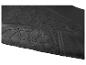 Gros plan d'un tapis de sol de voiture en caoutchouc noir texturé.