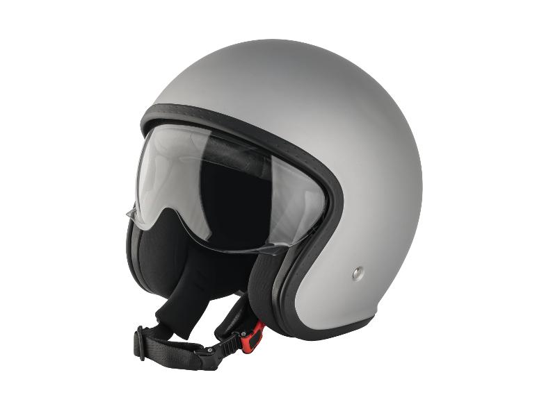 Un casque de moto argenté avec une visière transparente.