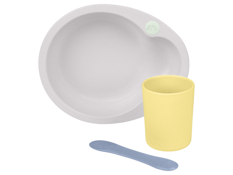 Une assiette grise, un gobelet jaune et une cuillère bleue de la marque Babecco.