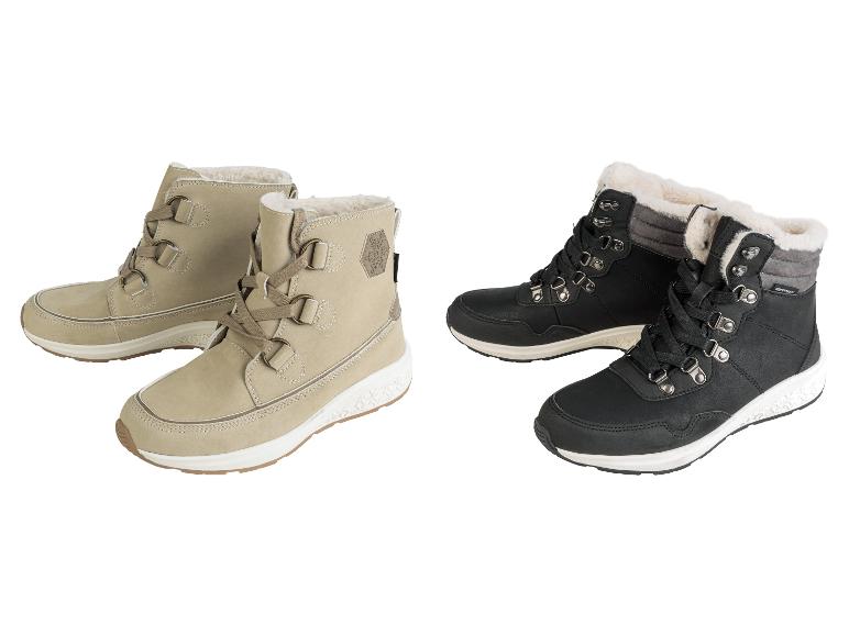 Beige en zwarte winterlaarzen met veters.