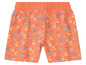 Short orange avec un motif de tongs et de palmiers.