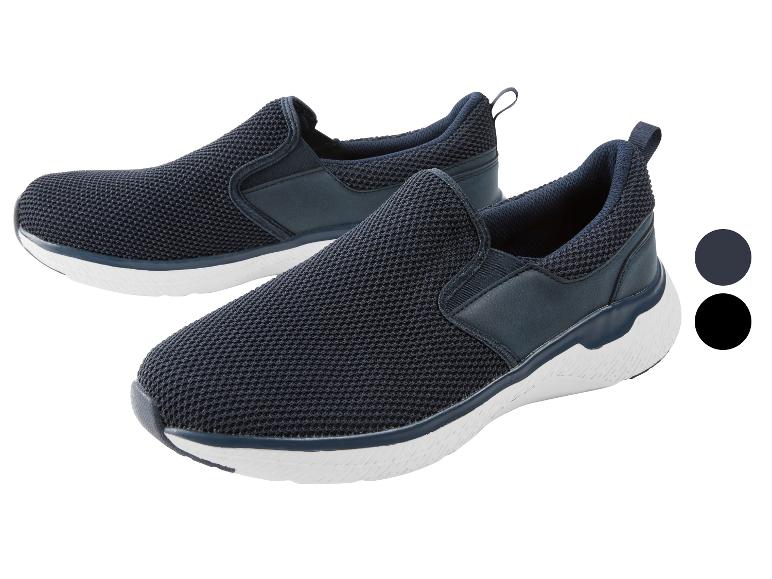 Baskets homme bleu marine foncé avec semelles blanches.