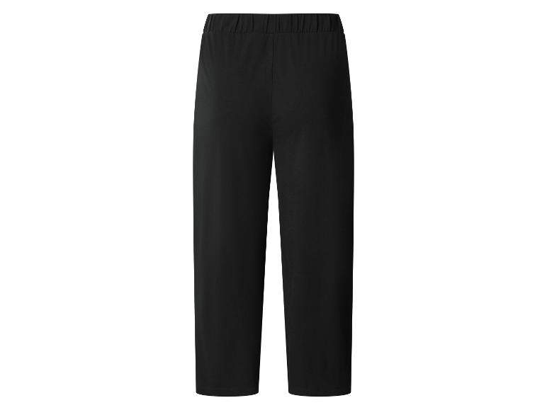 Zwarte, losse sportbroek met elastische tailleband.