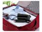 Valise ouverte avec chemise, lunettes de soleil et défroisseur vapeur SilverCrest.