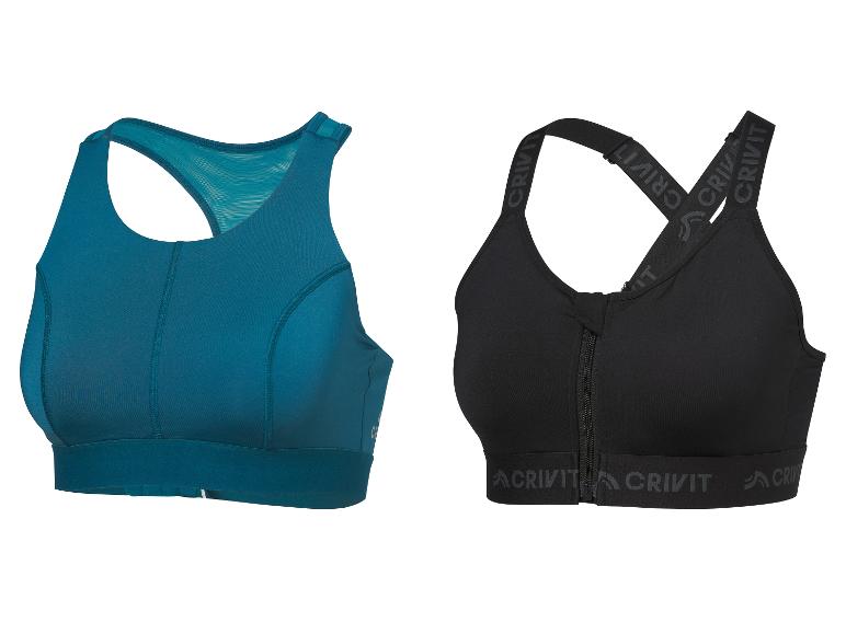 Twee sportbeha's: een blauwgroene racerback en een zwarte met ritssluiting aan de voorkant en Crivit-bandjes.