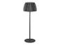 Lampadaire moderne avec abat-jour plissé et base ronde.