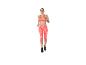 Femme en brassière de sport orange et legging à motifs, courant