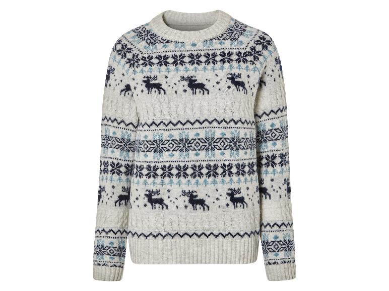 Un pull blanc avec un motif de Noël de rennes et de flocons de neige.
