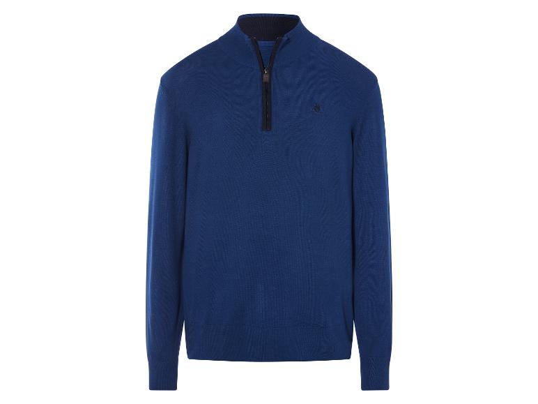 Un pull en laine bleu avec une fermeture éclair et un petit logo.