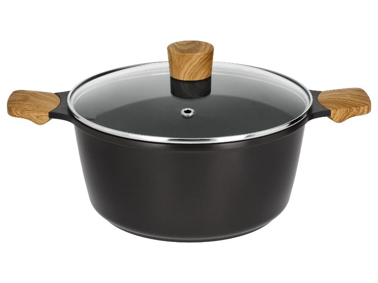 Marmite noire avec couvercle en verre et poignées en bois.