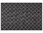Tapis de sol avec motif géométrique de trèfle noir et blanc.