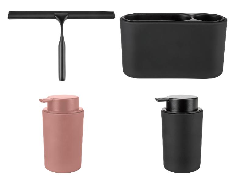 Zwarte badkameraccessoires, inclusief een raamwisser, een tandenborstelhouder en zeepdispensers in zwart en rosé goud.