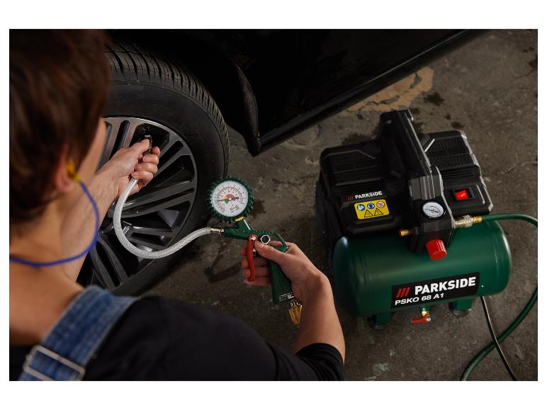 Een persoon die een autoband oppompt met een Parkside compressor.