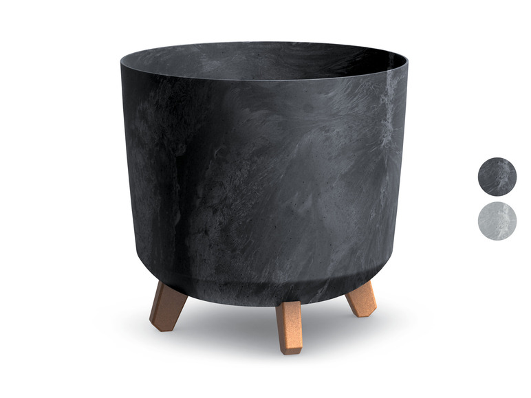 Pot de fleurs noir avec des pieds en bois