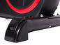 Vélo d'appartement noir et rouge avec bouton de réglage de la résistance.