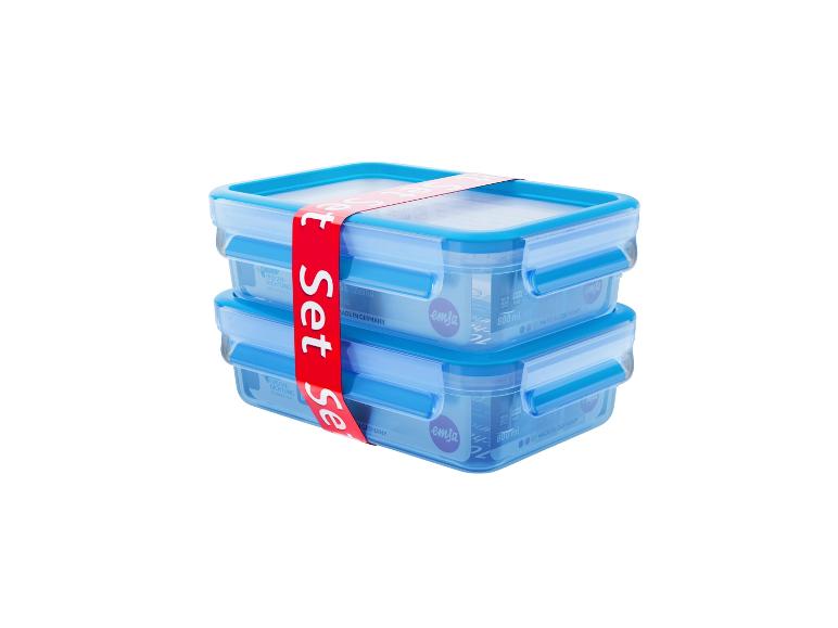 Deux récipients de conservation en plastique bleus empilés avec couvercles, liés par une bande rouge 'Set'.