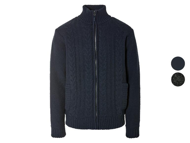Un pull en maille bleu foncé avec fermeture éclair.