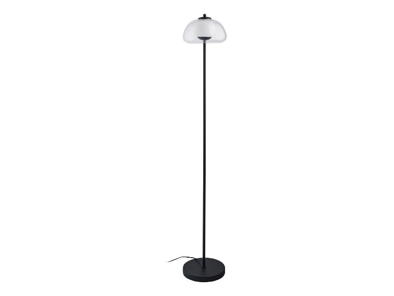 Moderne staande lamp met een transparante glazen kap.