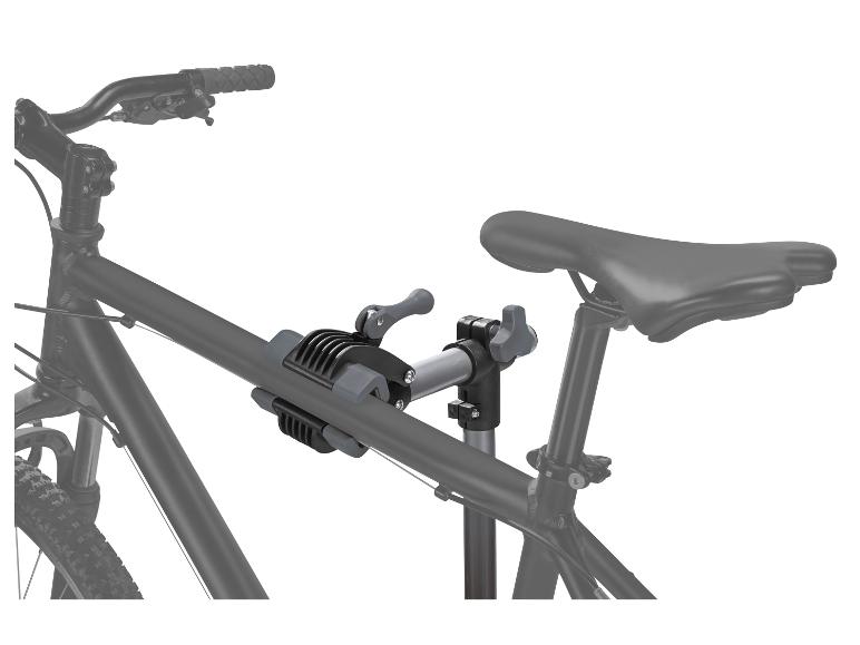 Een zwarte fiets met een grijze fietsstandaard.