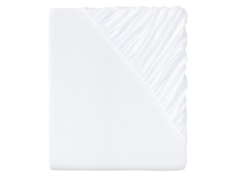 Drap housse blanc avec élastique.