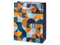Sac cadeau avec motif géométrique dans les tons orange, bleu marine et bleu clair.