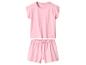 Pyjama deux pièces rose pour fille à pois blancs.
