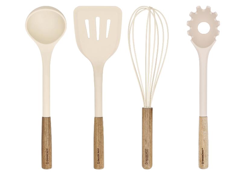 Ensemble d'ustensiles de cuisine avec louche, spatule ajourée, fouet et cuillère à pâtes avec manches en bois