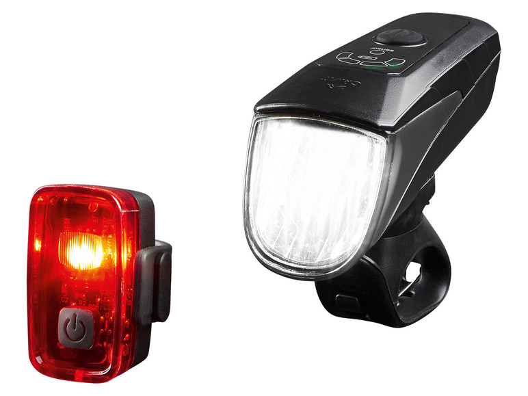 Een zwarte fietslamp met sensor en een rode achterlicht.