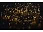 Guirlande lumineuse LED blanc chaud sur fond noir.