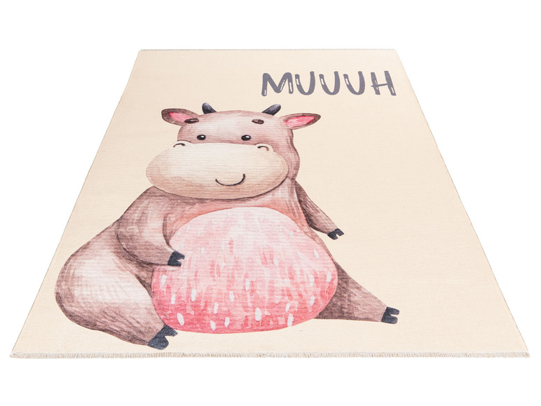 Beige vloerkleed met een schattige koe