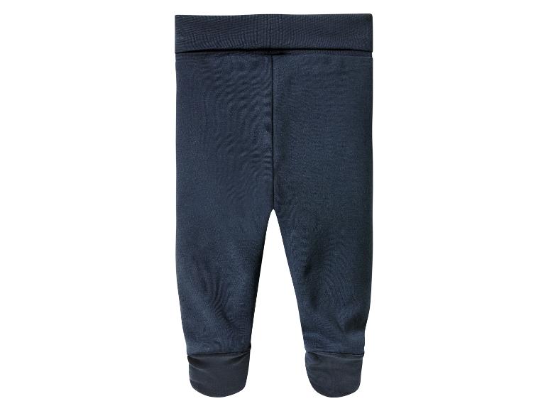 Donkerblauwe baby leggings met boorden aan de enkels.