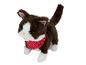 Een bruin en wit pluche katten speelgoed met een rood met witte stippen sjaal.