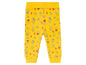 Pantalon jaune pour bébé avec imprimé de maisons.