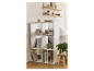 Étagère blanche à neuf cubes avec des livres, une radio et des objets décoratifs dans une chambre.