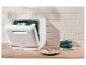 Lave-vaisselle SilverCrest sur un plan de travail en bois dans une cuisine moderne.