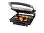 Een open elektrische grill met diverse gegrilde etenswaren zoals kip, groenten en spiesjes.