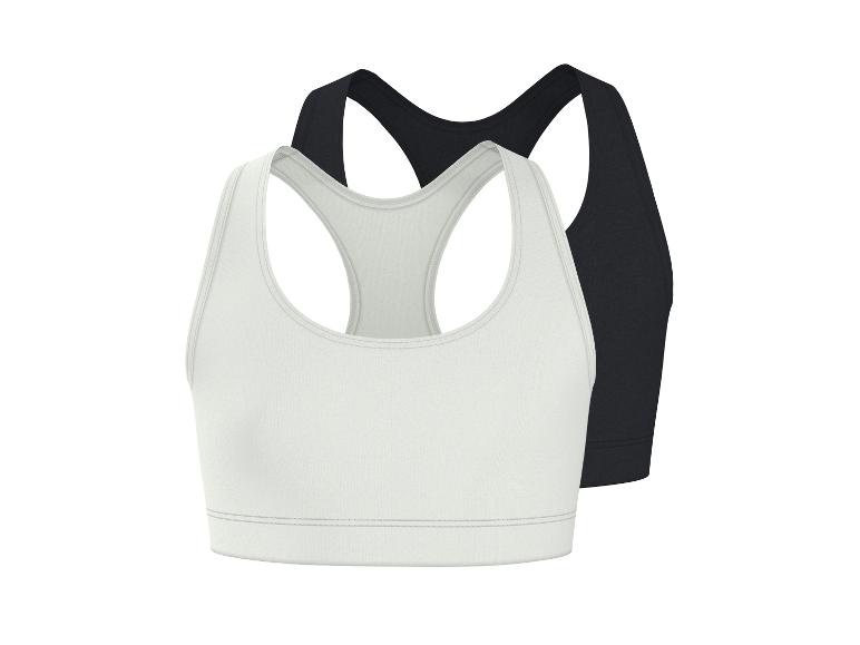 Twee sportbeha's, één wit en één zwart, met een racerback-ontwerp.