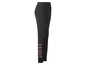 Zwarte leggings met 'UNIQUE' opschrift.