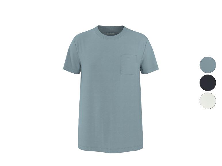 T-shirt à manches courtes avec poche poitrine, disponible en bleu, noir et blanc.