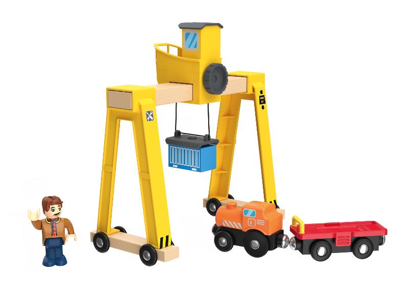Ensemble de jouets en bois avec grue portuaire, train et figurine.