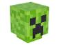 Cube vert pixélisé avec des traits faciaux noirs, ressemblant à un personnage de jeu vidéo.