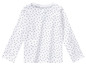 Wit T-shirt met lange mouwen en een hartjesprint.
