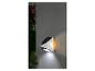 LIVARNO home led-wandlamp op zonne-energie met bewegingsmelder op een grijze muur.