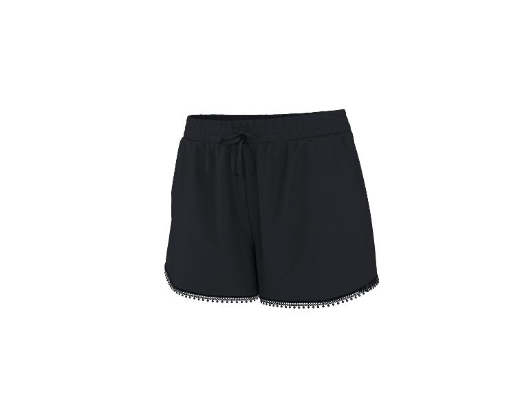 Zwarte shorts met trekkoord in de taille en kwastjes aan de zoom.